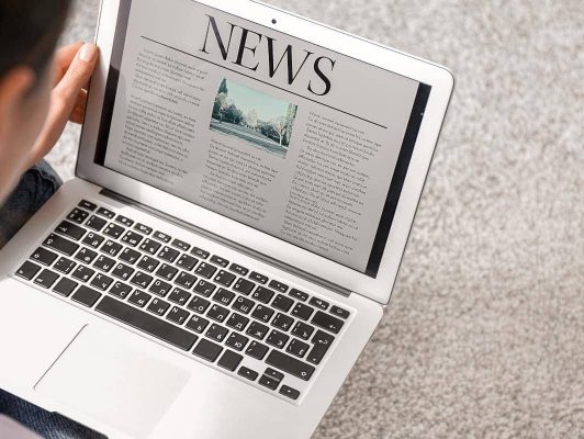 a journal article on a laptop screen